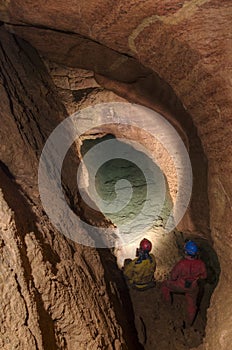 Speleologists in cave