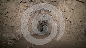 Speleology artificial cave dark tunnel excavation underground. Old adit for the extraction of metal and rocks