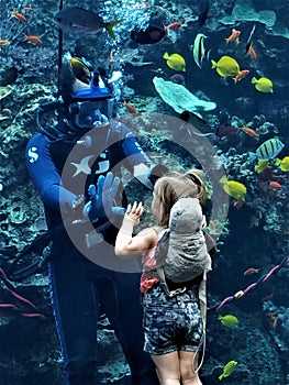 Girl and Diver High Five