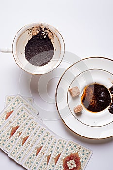 Spelling cards and cup with  coffee grounds  around white