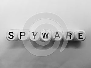 Spelling of spyware using wooden dice