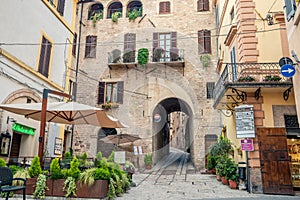 Traditional italian medieval alley and buildings in the historic center of beautiful town of Spello, in Umbria Region, Italy