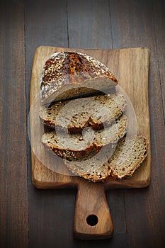 Spelt flour bread, sliced on a cutting board for breakfast