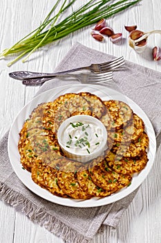 Spelt flour pancakes on white plate, top view