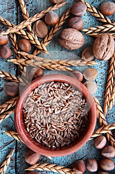 Spelt grain arrangement in pottery bowl