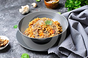 Spelt Pumpkin Mushroom Risotto on Grey Background, Vegetarian Meal