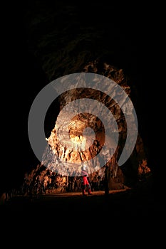 Spelunker in a cave photo