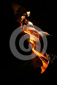 Spelunker exploring a cave photo