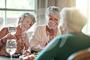 Spend your golden years with friends. Cropped shot of a group of senior female friends enjoying a lunch date.