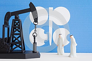 Spending or investment of a country `s revenues from petroleum exports industry Petrodollar. Oil pump jack and arab men