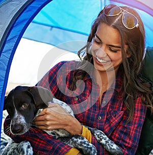 Spending some alone time with my best friend. a young woman out camping with her dog.