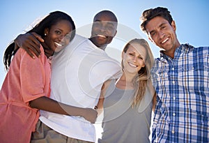 Spending time on the beach with great friends. Cropped portrait of two happy couples enjoying a day at the beach.