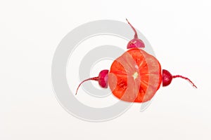 Sperm swimming toward to egg concept. crimson giant red radish and red tomato vegetable