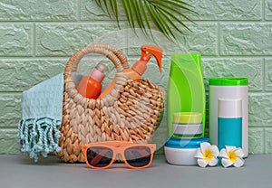 SPF sunscreens in a beach basket