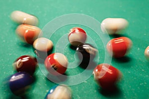 Spheres scatter on a billiard table.