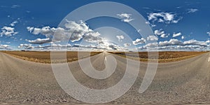 spherical 360 hdri panorama on asphalt road with clouds and sun on blue sky in equirectangular seamless projection, as sky