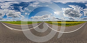 spherical 360 hdri panorama on asphalt road with dividing line among farming field in equirectangular seamless projection, use as