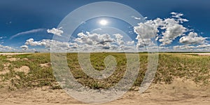 spherical 360 hdri panorama among dry grass farming field with clouds on blue sky in equirectangular seamless projection, use as