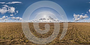 spherical 360 hdri panorama among farming field with clouds on blue sky in equirectangular seamless projection, use as sky