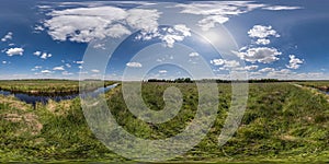 spherical 360 hdri panorama among green grass farming field near melioration reclamation canal in equirectangular seamless