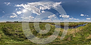 spherical 360 hdri panorama among green grass farming field near melioration reclamation canal in equirectangular seamless