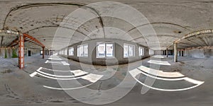 Spherical 360 hdri panorama in abandoned interior of large empty room as warehouse, hangar or gallary with rays of sun through