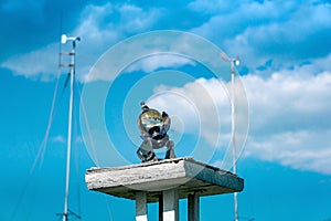 Spherical meteorological sunshine recorder heliograph at the weather station against the sky photo