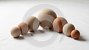 Of spherical objects in different sizes are arranged in a row on a