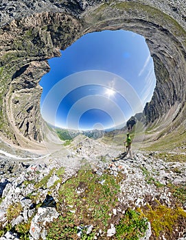 Spherical panorama 360 to 180 The man stands on top in the mount