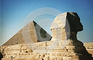 The Sphinx at dusk next to the famed Pyramids of Giza - The last Remaining SEVEN WONDERS OF THE ANCIENT WORLD - EGYPT - AFRICA