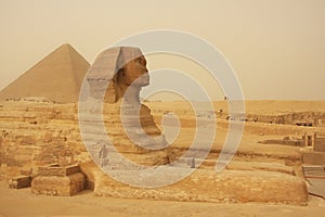 The Sphinx and Great Pyramid of Khufu in a sand storm, Cairo