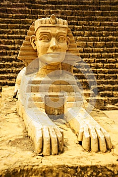Sphinx model with pyramid background