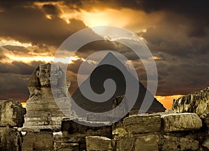 The Sphinx and the pyramid of Cheops in Giza Egipt at sunset