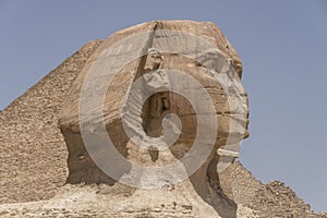 Sphinx with pyramids in the background