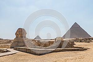 Sphinx with Pyramids in the the Giza pyramid complex, which includes the three Great Pyramids Khufu/Cheops, Khafre/Chephren and