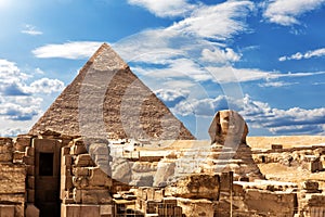 The Sphinx, the Temple and the Pyramid of Chephren under the clouds in Giza