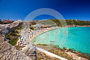 Spiaggia di Rena Bianca beach with red rocks and azure clear water, Santa Terasa Gallura, Costa Smeralda, Sardinia, Italy photo