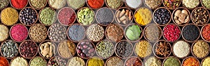 Different seasonings in cups. Spice background on the table photo