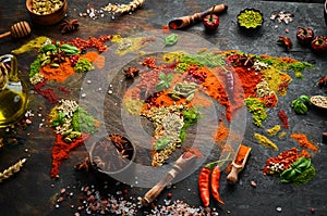 Spice banner. The map of the world is made of various spices and seasonings on a dark background.