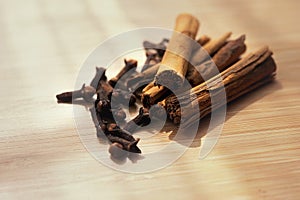 Spice cinnamon clove on a wooden board