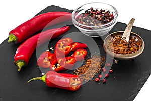 Spice in cooking red chili pepper on black stone