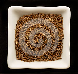Spice cumin in a ceramic bowl.