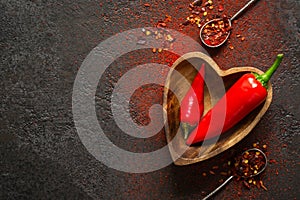 Spice Food Background. Red hot pepper in a wooden bowl