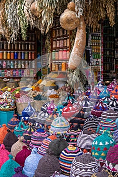 Spice and knitted hats  market stall in Marrakech, Morocco