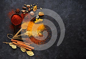 Spice seasoning in metal spoons photo