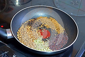 Spice seeds in pan ready to dry. Dry fry or roast.