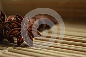 Spice star anise on a bamboo mat