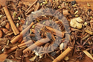 Spice for tea, coffe, baking on wooden table.