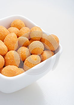 Spiced coated fried peanut.