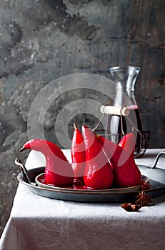 Spiced hibiscus or red wine poached pears. Delicious winter french dessert.